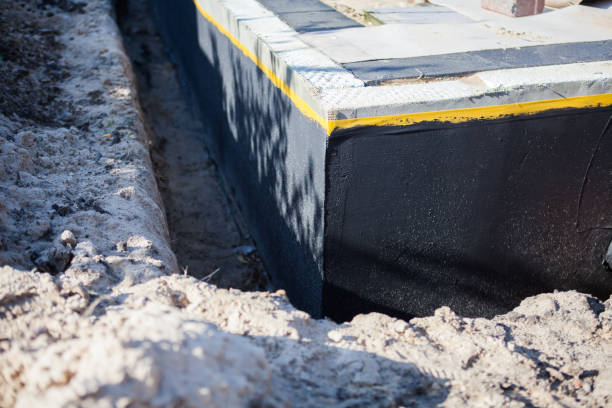 Professional Waterproofing technician working in Mathews, VA